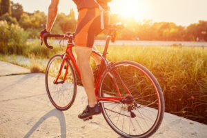 young man are cycling road bike in the evening